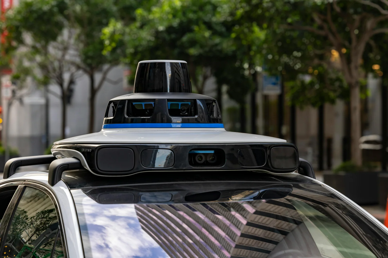 A futuristic cityscape with robotaxis in motion